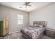 Bedroom with a ceiling fan, carpet flooring, and comfortable furniture at 12158 S 184Th Ave, Goodyear, AZ 85338