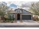 Charming single-story home with a stone-accented entryway and low-maintenance desert landscaping at 12158 S 184Th Ave, Goodyear, AZ 85338