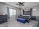 Cozy main bedroom with a stylish ceiling fan and comfortable decor at 12158 S 184Th Ave, Goodyear, AZ 85338