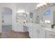 Bathroom suite featuring dual sinks, generous counter space, and separate tub area at 1248 E Briarwood Ter, Phoenix, AZ 85048