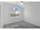 Neutral bedroom featuring plush carpeting, natural lighting, and ceiling fan fixture at 1248 E Briarwood Ter, Phoenix, AZ 85048
