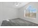 Well-lit bedroom featuring large windows and vaulted ceilings at 1248 E Briarwood Ter, Phoenix, AZ 85048