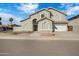 Two-story home featuring a well-manicured lawn, mature landscaping, and an attached two-car garage at 1248 E Briarwood Ter, Phoenix, AZ 85048