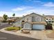 Two-story home featuring a well-manicured lawn, mature landscaping, and an attached two-car garage at 1248 E Briarwood Ter, Phoenix, AZ 85048