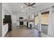 Well-lit kitchen with white cabinets, granite countertops, stainless steel appliances, and a view of the pool at 1248 E Briarwood Ter, Phoenix, AZ 85048