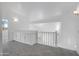 Upstairs loft area complete with built-in cabinets, carpeting, and natural lighting at 1248 E Briarwood Ter, Phoenix, AZ 85048