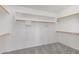 Walk-in closet featuring ample shelving for storage and organization at 1248 E Briarwood Ter, Phoenix, AZ 85048