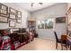 Bright room with ample natural light and wooden floors, decorated with a daybed and charming decor at 12835 W Chapala Ct, Sun City West, AZ 85375
