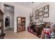Cozy room featuring a daybed, hardwood floors, and decorative furnishings at 12835 W Chapala Ct, Sun City West, AZ 85375