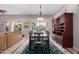 Elegant dining room with a dining table and decorative hutch at 12835 W Chapala Ct, Sun City West, AZ 85375