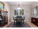 Intimate breakfast nook featuring shuttered windows with a unique, modern light fixture at 12835 W Chapala Ct, Sun City West, AZ 85375
