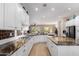 Bright kitchen with granite countertops, and stainless steel appliances at 12835 W Chapala Ct, Sun City West, AZ 85375