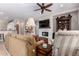 Inviting living room features recessed lighting, ceiling fan and tile fireplace at 12835 W Chapala Ct, Sun City West, AZ 85375
