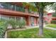 Charming two-story home with brick accents, a well-maintained lawn, and mature trees at 130 E Coronado Rd # 16, Phoenix, AZ 85004