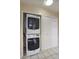 Convenient laundry closet with a stacked washer and dryer unit, next to closet at 130 E Coronado Rd # 16, Phoenix, AZ 85004