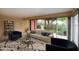 Bright living room with large windows, comfortable seating, and stylish decor at 130 E Coronado Rd # 16, Phoenix, AZ 85004