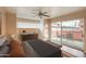 Serene bedroom with a ceiling fan, dresser, and private patio with views at 130 E Coronado Rd # 16, Phoenix, AZ 85004