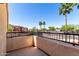 Balcony with black iron railing and a view of palm trees and the neighborhood at 14575 W Mountain View Blvd # 621, Surprise, AZ 85374