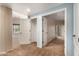 Bright bedroom with plush carpeting and neutral walls, leading to a closet and a private balcony at 14575 W Mountain View Blvd # 621, Surprise, AZ 85374
