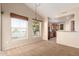 Bright dining area with large windows and an open view to the kitchen at 14575 W Mountain View Blvd # 621, Surprise, AZ 85374