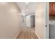 Carpeted hallway provides access to different rooms, including a laundry area, ensuring convenience and functionality at 14575 W Mountain View Blvd # 621, Surprise, AZ 85374