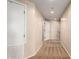 Well-lit hallway showcasing multiple doors and access points, connecting various areas with utility and storage space at 14575 W Mountain View Blvd # 621, Surprise, AZ 85374