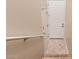 View of the staircase landing featuring two white doors and tile flooring for added utility at 14575 W Mountain View Blvd # 621, Surprise, AZ 85374