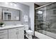 Beautiful bathroom featuring a modern vanity, updated toilet, and tiled shower and tub enclosure at 14841 N 62Nd Way, Scottsdale, AZ 85254