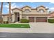 Charming two-story home featuring a well-manicured lawn, tile roof, and inviting curb appeal at 14841 N 62Nd Way, Scottsdale, AZ 85254
