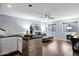 Well-lit living room with bar and kitchenette area and comfortable furniture at 14841 N 62Nd Way, Scottsdale, AZ 85254