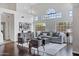 Bright living room boasts high ceilings, large windows, and modern decor at 14841 N 62Nd Way, Scottsdale, AZ 85254