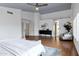 Large main bedroom features hardwood floors, vaulted ceilings, ceiling fan and barn door access to bathroom at 14841 N 62Nd Way, Scottsdale, AZ 85254