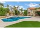 Outdoor pool with hot tub, patio, grassy area and outdoor kitchen at 14841 N 62Nd Way, Scottsdale, AZ 85254