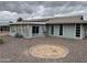 Well-maintained backyard with a patio, gravel landscaping, and privacy at 16805 N 110Th Ave, Sun City, AZ 85351