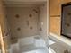 Bathroom featuring a shower and bathtub combination and vanity at 16805 N 110Th Ave, Sun City, AZ 85351