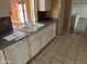Bright kitchen with sleek white cabinetry, granite countertops, and stainless steel appliances at 16805 N 110Th Ave, Sun City, AZ 85351