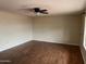 Spacious living room featuring hardwood floors and a modern ceiling fan at 16805 N 110Th Ave, Sun City, AZ 85351