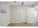 A bright bedroom showcases light grey walls, wood floors and sliding closet doors at 1718 S Marilyn Ann Dr, Tempe, AZ 85281