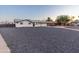 Inviting single-story home with a well-manicured exterior, a gravel yard and a driveway at 1718 S Marilyn Ann Dr, Tempe, AZ 85281