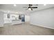 Open-concept kitchen featuring white cabinets, an island, and modern appliances with wood floor at 1718 S Marilyn Ann Dr, Tempe, AZ 85281