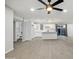 Bright kitchen featuring white cabinets, an island, and open layout, with wood-look flooring at 1718 S Marilyn Ann Dr, Tempe, AZ 85281
