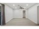 A bright living room with wood floor and recessed lighting, with doors to the outside at 1718 S Marilyn Ann Dr, Tempe, AZ 85281