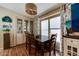 Elegant dining area with hardwood floors, stylish lighting, and classic decor at 17200 W Bell Rd # 1643, Surprise, AZ 85374