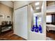 Hallway featuring decorative vases and access to the bedroom and kitchen at 17200 W Bell Rd # 1643, Surprise, AZ 85374