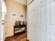 Hallway featuring a decorative console table and coat closet at 17200 W Bell Rd # 1643, Surprise, AZ 85374
