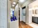 Hallway featuring decorative blue vases and access to the laundry and bath at 17200 W Bell Rd # 1643, Surprise, AZ 85374