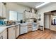 Efficient kitchen with updated appliances, ample cabinet space, and hardwood floors at 17200 W Bell Rd # 1643, Surprise, AZ 85374
