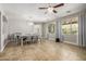 This dining room features tiled floors, a decorative chandelier, and ample space for entertaining at 18543 E Purple Sage Dr, Queen Creek, AZ 85142