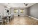 Spacious dining room with a chandelier, large windows and tiled flooring at 18543 E Purple Sage Dr, Queen Creek, AZ 85142