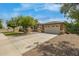 Lovely single-story home featuring desert landscaping, a driveway, and an attached two-car garage at 18543 E Purple Sage Dr, Queen Creek, AZ 85142